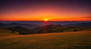 Dramatic sunset over a vast countryside landscape with rolling hills and golden grassy fields photo