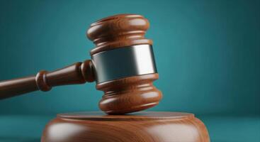 Wooden Gavel and Sound Block Symbolizing Law and Justice on a Teal Background photo