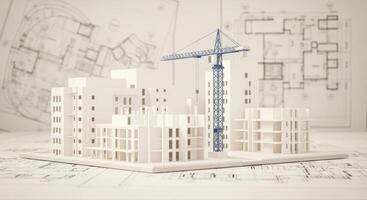 Architectural model of a building under construction featuring white structures and a blue crane. photo