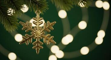 Golden Snowflake Ornament on Christmas Tree with Blurred Festive Lights and Bokeh Effect photo