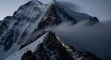 Lone Climber Ascending a Treacherous Snow Covered Mountain Peak at Dawn photo