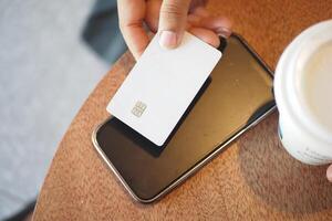 Using contactless payment technology at a cafe photo