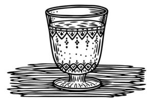 Ornate vintage drinking glass with decorative patterns on wooden table, retro cup illustration in black and white vector