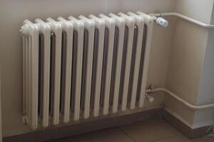 Radiator installed in a room for heating during winter photo