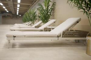 Relaxation loungers in a serene indoor space photo