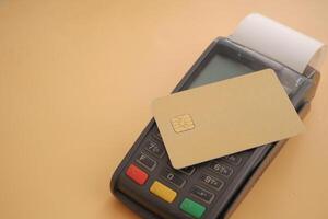 Payment terminal with card on countertop in retail space photo