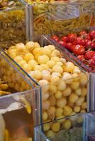 Fresh pickles selling in a market display photo