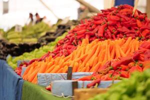 Colorful display of fresh vegetables at local market photo