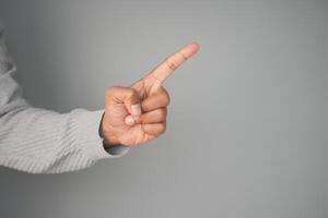 Finger pointing gesture indicating a key idea or suggestion photo