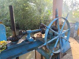 An irrigation sluice gate located on a small dam. This sluice gate mechanism is used to control the water level in a river or irrigation channel photo