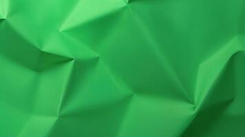 Crumpled paper stop motion animation, Textured green paper background The concept of sketch pad, design, retro style, wrinkle, frayed, blank video
