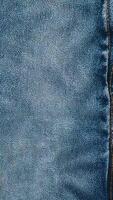 Blue jeans levis stop motion animation, textured material vertical background. Pad sketch concept, design, retro style, wrinkled, frayed, empty video