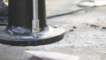 Construction worker drills into concrete surface video