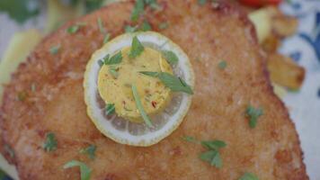 Golden Fried Schnitzel Served With Lemon Butter Garnish and Crisp Parsley Touch video
