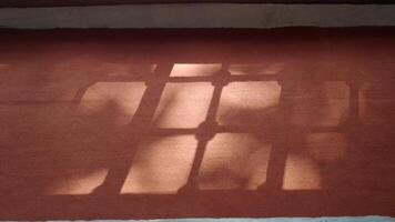 Shadows create patterns on warm carpet surface video
