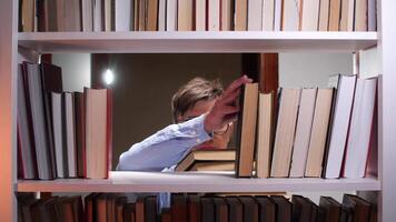 A person is looking at a book shelf video