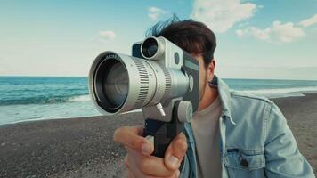 Man With A Vintage Film Camera And Using The Old Lens At The Sea video