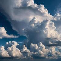 The vast blue sky has fluffy white clouds floating gently in it photo