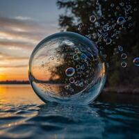 A glass ball floats on water with bubbles emerging from it photo