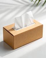 A tissue box with a tissue inside on a white surface photo
