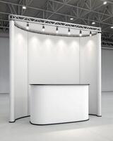 A white display booth with a counter and lights photo