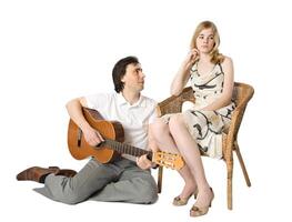 Man playing guitar for a girl, white background photo