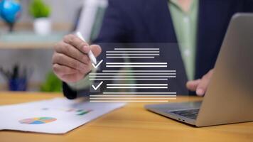Hand with pen interacting with digital checklist. Symbolizes data entry, task completion, online forms, and business reporting. Ideal for productivity, compliance, analysis, efficient management now. photo