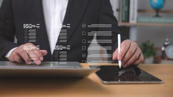 Digital audit in action as businessman reviews online forms and checklist, ensuring financial transparency, compliance, and efficient management through smart digital verification tools. photo