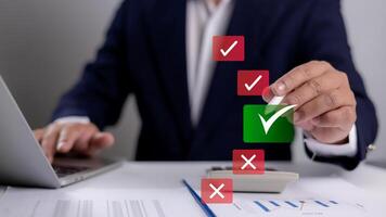 Hand man presses a green checkmark on a digital document, symbolizing approval, validation, and confirmation in a modern business or legal workflow. represents efficiency and successful completion. photo