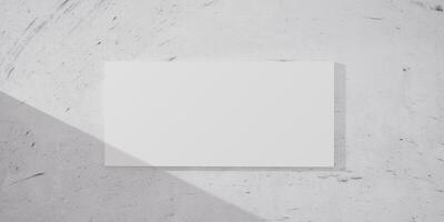 Minimalist white canvas on a marble wall with dramatic light and shadow play. Blank template for creative artwork, photography, print display in contemporary home or office interior design. 3d render. photo