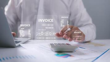 Digital online e-invoice concept, Businessman using laptop computer with invoice icon, E-tax, Digital receipt, Invoice for payment, Digital invoice document, Online invoice processing, Tax accounting photo
