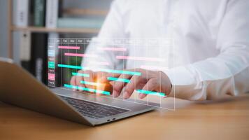 Businessman using project management software on a laptop to schedule tasks, update Gantt charts, and manage workflow, enhancing planning, productivity, and business progress. photo