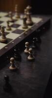 Male hand rearranges pieces on the chessboard, close up. Playing chess alone, filming without a face, unidentified person, vertical photo