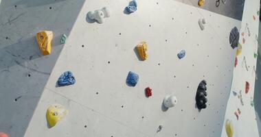 Shooting a Rock Climbing Wall with many irregularities and angles that simulate rocks and ledges, close up without people. photo
