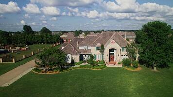 An overview of an old cottage in a low rise building area in America. Drone . A sunny summer day photo