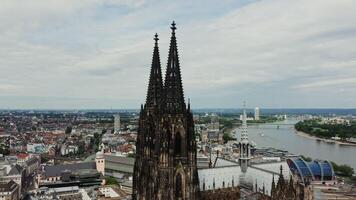 Overview of spiers of the Cathedral of Saints Peter and Mary, panoramic bird's eye view from a drone. Cologne Cathedral in the historic city center. Cologne, Germany photo