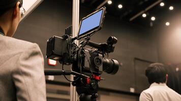 Professional cinema cameras being used in a studio or event setting. High end gear with crew operation and behind the scenes vdo production in action. Camera for Live recording and broadcasting. photo