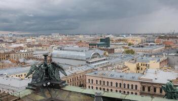 View of St. Petersburg Skyline With Dramatic Clouds and Historical Architecture During Overcast Afternoon photo
