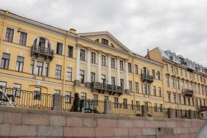 Elegant Architecture Along the Neva River Complements a Cloudy Day in St Petersburg With Historic Buildings and Charming Details photo