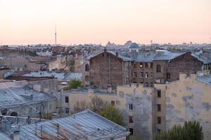 View Over Rooftops of St Petersburg During Twilight With a Pastel Sky Showcasing the Citys Architecture and Rooftops photo