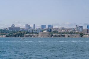 Bosphorus view showcasing modern skyline and historical architecture under clear sky photo