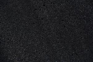 Foundation of cellular latex foam. Black foam rubber. Packaging material. photo