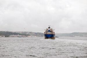 Bosphorus waterway bustling with shipping traffic and cloudy skies photo