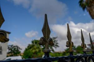 Detailed close-up of rustic fence elements showing texture, weathered wood, and metal parts, capturing the charm of traditional craftsmanship. photo
