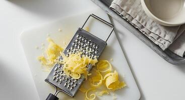 Grating Cheese on Cutting Board Overhead Food Preparation photo