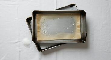 Preparing Baking Sheets with Parchment Paper and Scattered Sugar Crystals photo