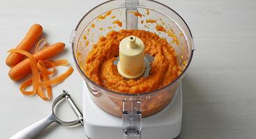 Preparing Carrot Puree in Food Processor with Fresh Carrots photo