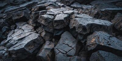 Closeup View of Jagged Dark Rocky Surface Texture photo