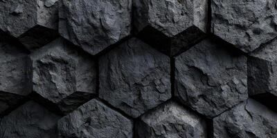 Close up of textured dark hexagonal stone blocks surface photo