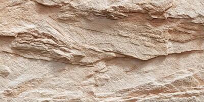 Close up texture of beige natural sandstone rock surface photo
